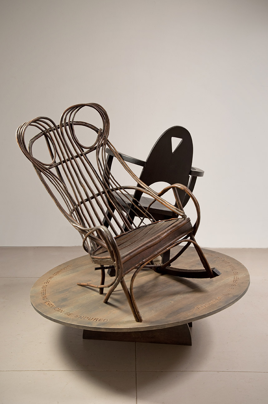 view1 – Frida Kahlo chair) wood & found chairs, 54”Hx48”Wx48”D, 2022