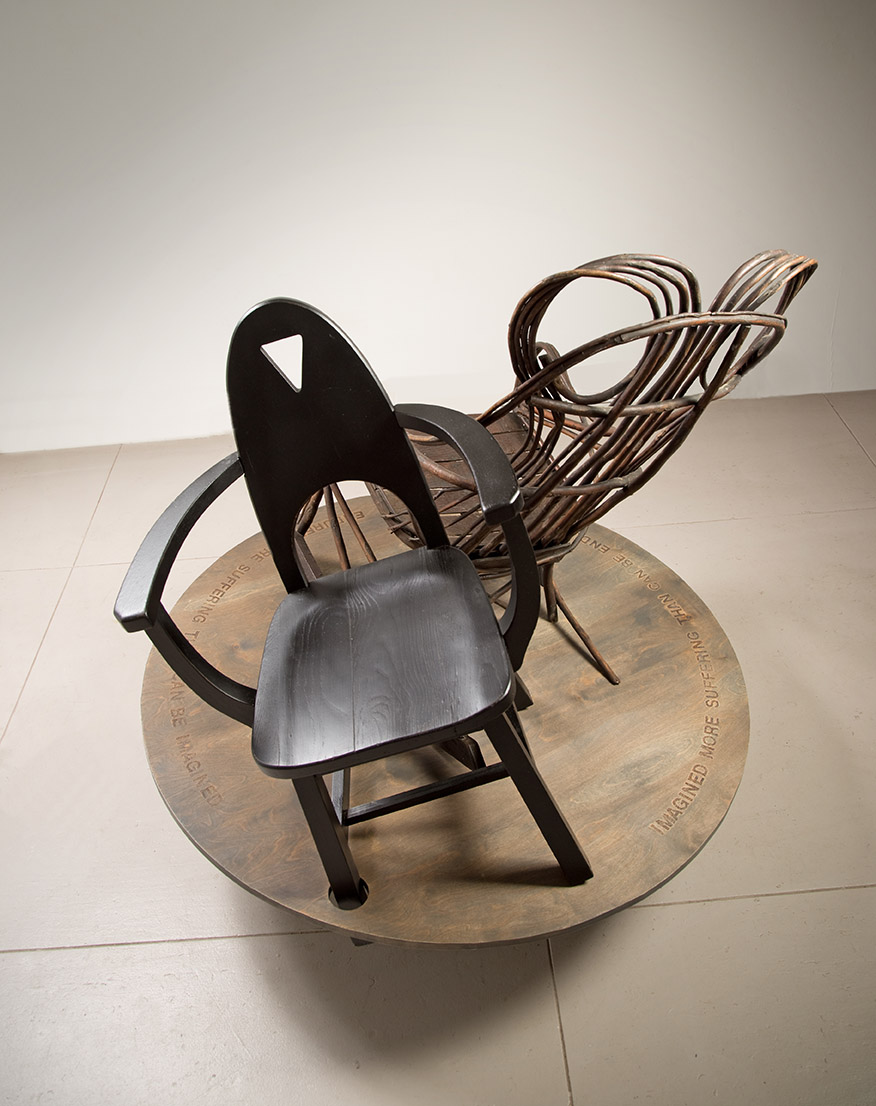 view2 – Franz Kafka chair) wood & found chairs, 54”Hx48”Wx48”D, 2022