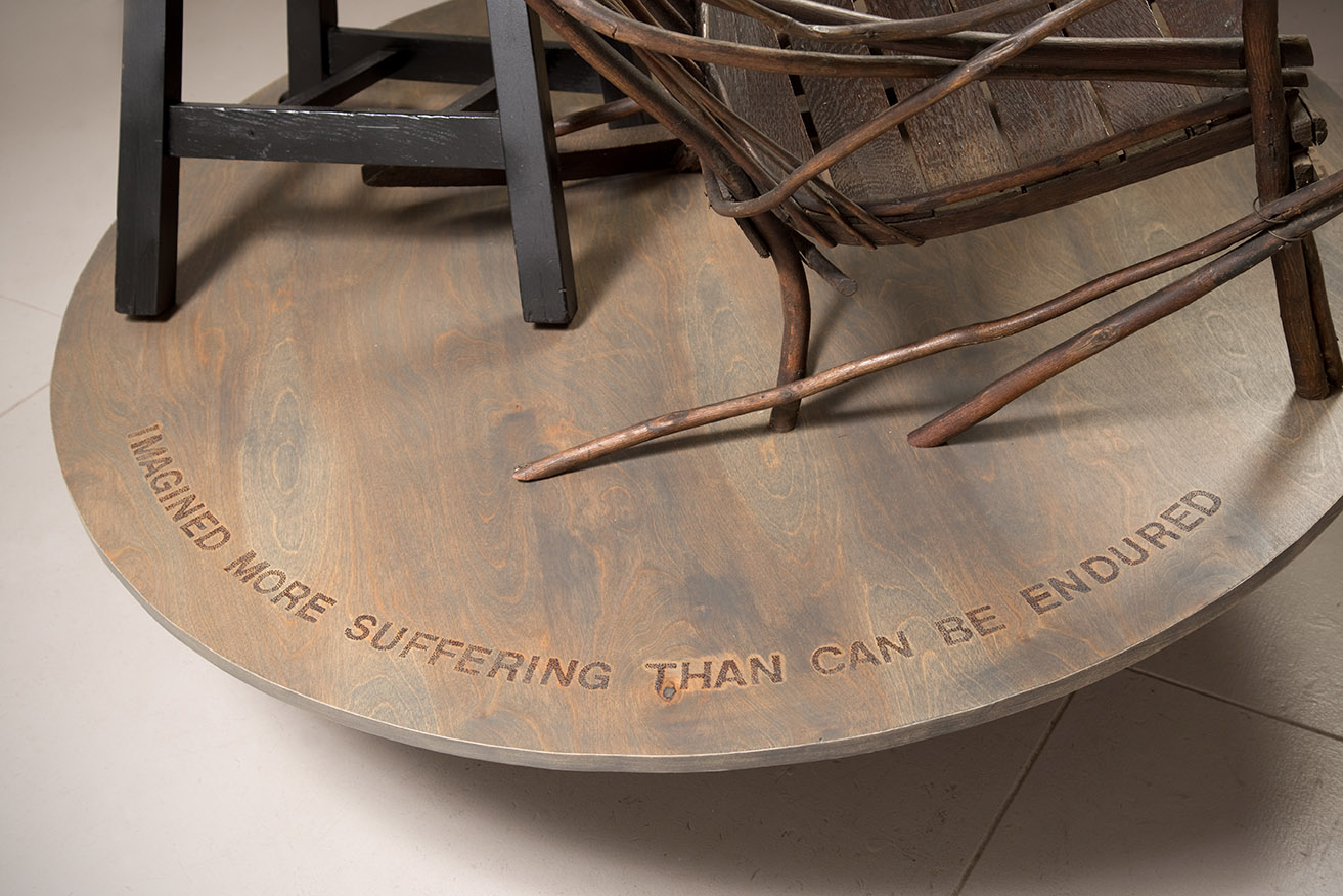 DETAIL– Franz Kafka inscription) wood & found chairs, 54”Hx48”Wx48”D, 2022